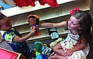 Corin and Savannah are playing with puppets