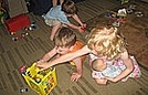 Savannah held her baby very gently as she cleaned up the blocks