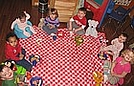 Having a picnic with their stuffed animals