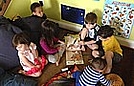 Jimmy is reading a book on CD to his friends
